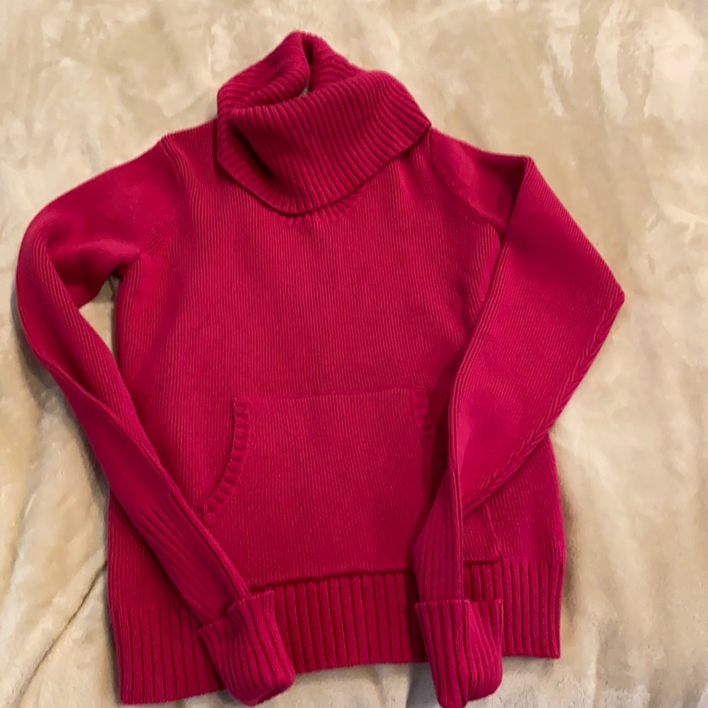 Pink 100 percent cotton turtleneck sweater.